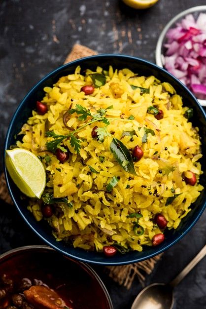 aloo kanda poha or tarri pohe with spicy chana masala or curry premium photo